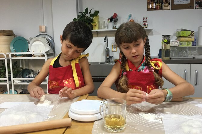 2.5hrs Chinese Kitchen Cooking Class: Xiaolongbao Soup Dumplings - Steaming and Pan-Frying the Dumplings