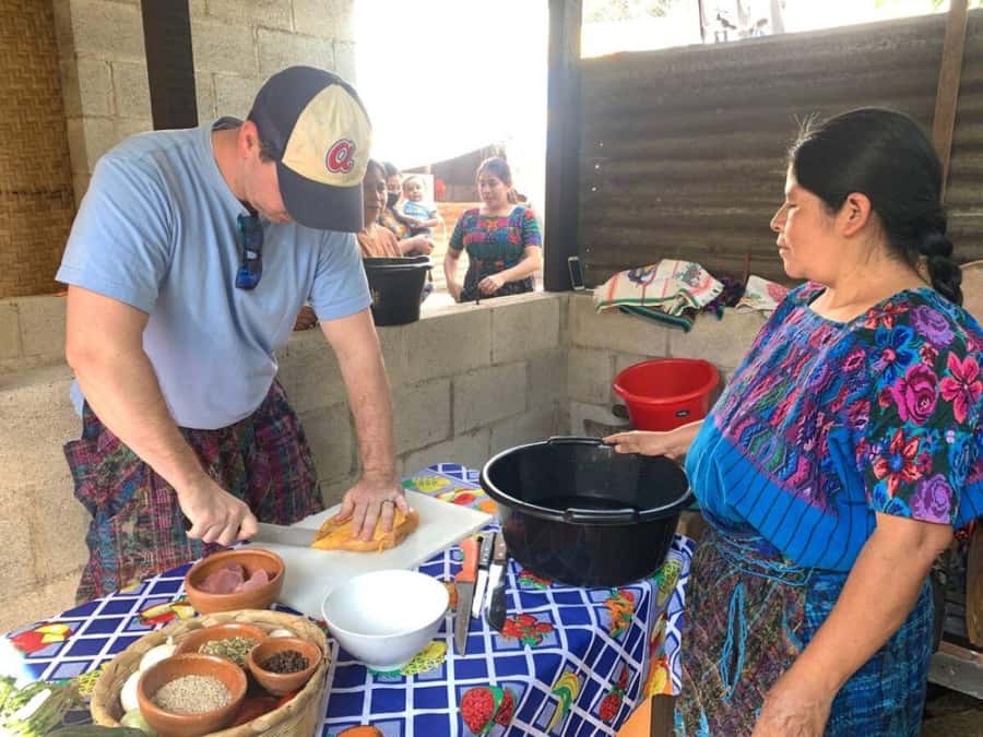 Antigua: Cooking Class with Local Family - Grinding corn and spices on the pedernal stone