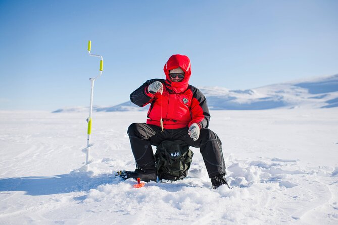 Arctic Fishing & Open Fire Cooking - Drilling the ice the traditional way