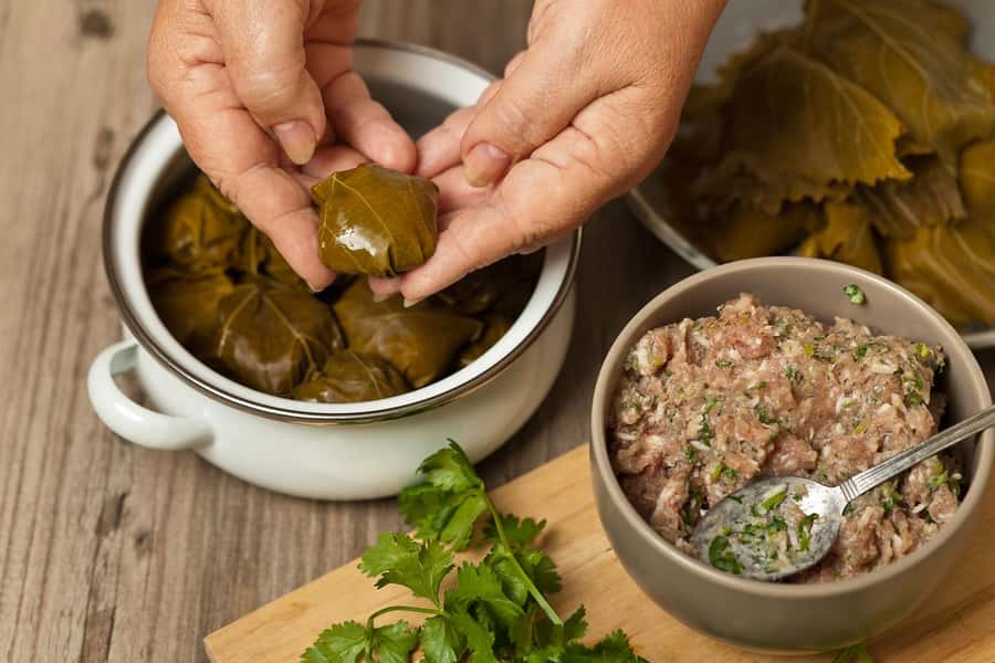 Azerbaijani Cooking Class & Old City Tour & Lunch - Folding qutab and mixing mint ayran