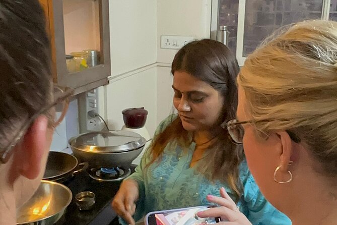 Bangalore: Traditional Cooking Classes & Dinner with Chef Family - Tasting spices before the cooking begins