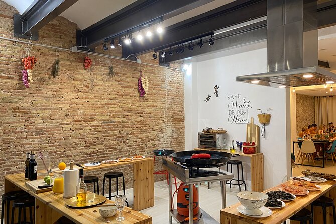 Barcelona: Black Ink Seafood Paella Cooking Class - Working with a professional chef