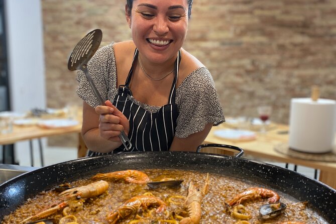 Barcelona Paella Cooking Class & Boqueria & Hofmann-Trained Chefs - Sitting down to eat what you prepared