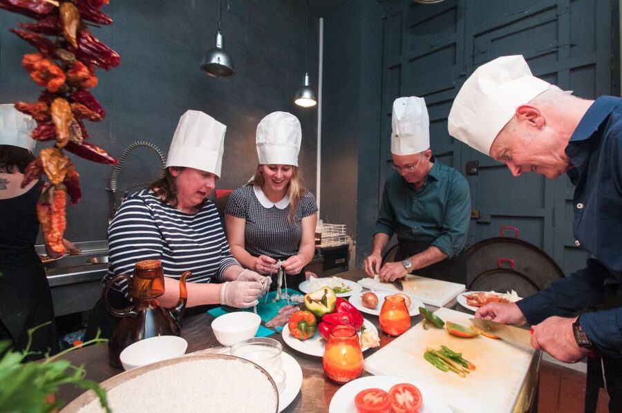 Barcelona: Paella Cooking Experience & Boqueria Market Tour - Tapas first, then the paella pan