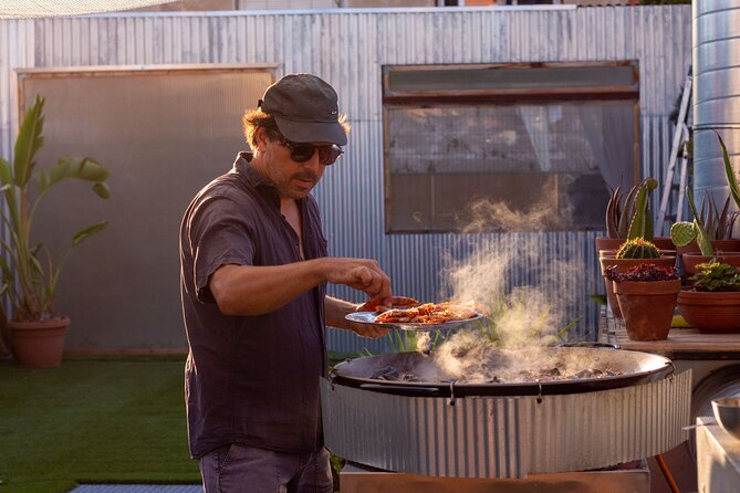 Barcelona Rooftop Paella Cooking Class with Sangria & Local Host - Cooking the Costa Brava seafood paella