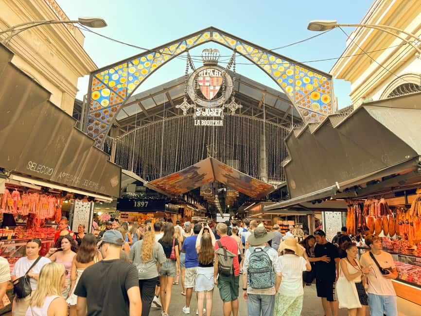Barcelona: Seafood Paella Cooking Class & Boqueria market - Meeting under the red umbrella at La Boqueria