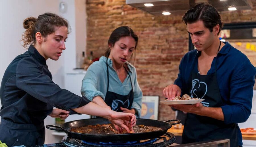 Barcelona: Seafood Paella Cooking Class & Boqueria market - Learning traditional paella with the chef