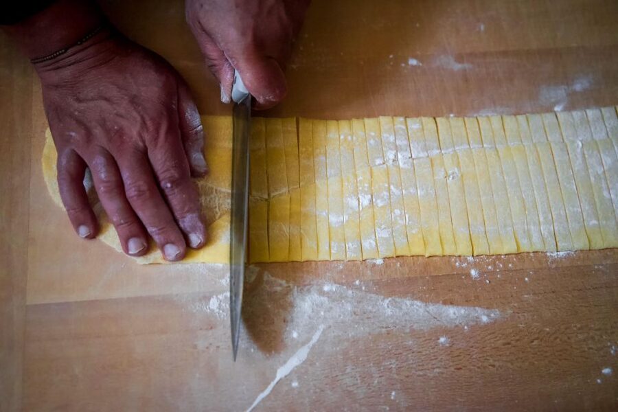 Bologna: Pasta Tagliatelle al Ragu Cooking Class with Wine - Rolling the dough for tagliatelle