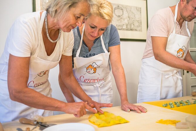 Bologna Walking Tour & Traditional Cooking Class with Wine - Preparing a regional Bolognese pasta dish