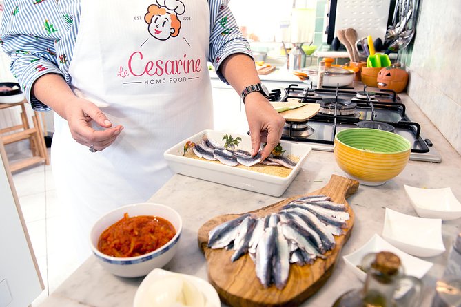 Cesarine: Home Cooking Class & Meal with a Local in Varenna - Eating your work with local wine
