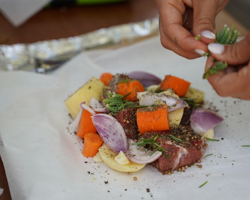Chania: Authentic Cooking Class - Gathering herbs and rolling grape leaves