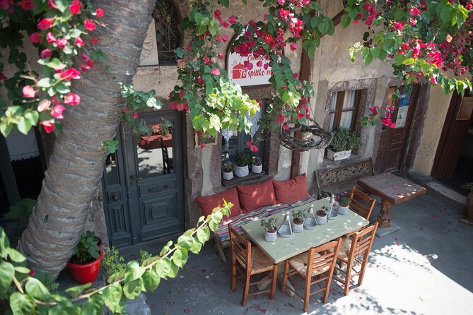 Cooking Class in Traditional cave house in Santorini! - The welcome, wine, and kitchen setup