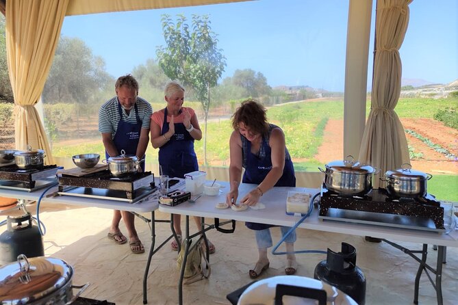 Cretan Cooking Class and Olive Oil Tasting - Sitting down to eat beneath the olive trees