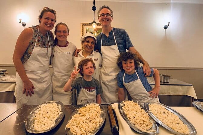 Florence: Cooking Class Pasta & Tiramisu Making Unlimited Wine - Sitting down to eat what you made