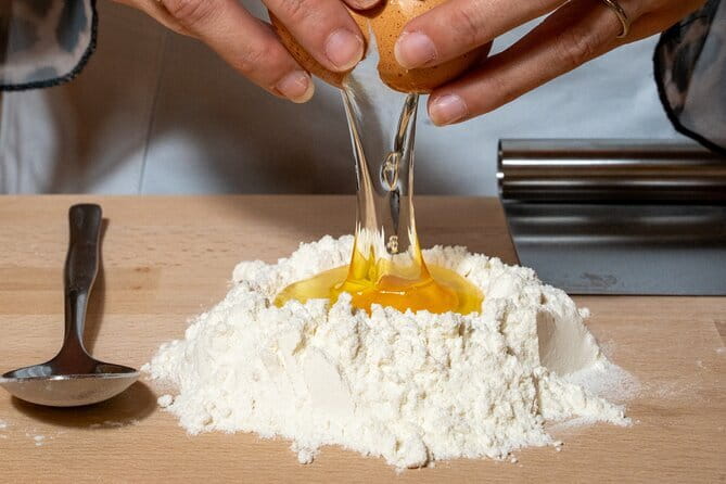 Florence: Pasta & Tiramisu Cooking Class with Unlimited Wine - Rolling pasta dough with an English-speaking chef