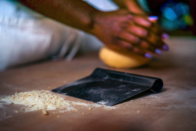 Genoa: Hands-On Home cooking Class Pasta Pesto and more with wine - Grinding Genoese pesto with a mortar and pestle