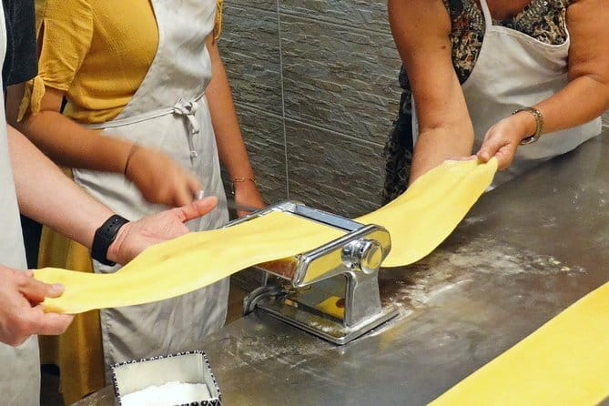 Hands-On Pasta Cooking Class in Florence with optional Pizza - Making dough with flour, eggs, and a rolling pin