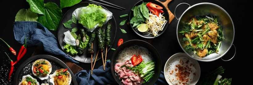 Hanoi Food Adventure: Vietnamese Market Tour & Cooking Class - Preparing four Vietnamese dishes at once
