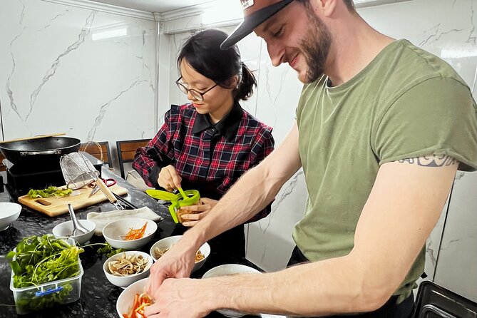 Hanoi Maya Kitchen: Traditional Cooking Class & Market Tour - Mixing Pho Tron and tasting the finished meal
