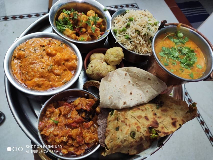 Jodhpur 9 Dishes Cooking Class Experience pickup and drop - Eating your own cooking on the terrace