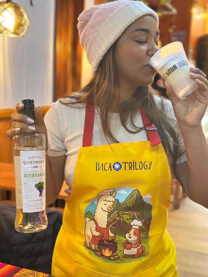 Lima: Cooking Workshop and Water Circuit Tour - Mixing pisco sours with a local chef