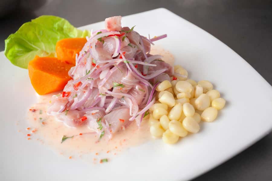 Lima: Market Tour and Cooking Class with Pisco Sour - Moving from market stalls to the restaurant kitchen