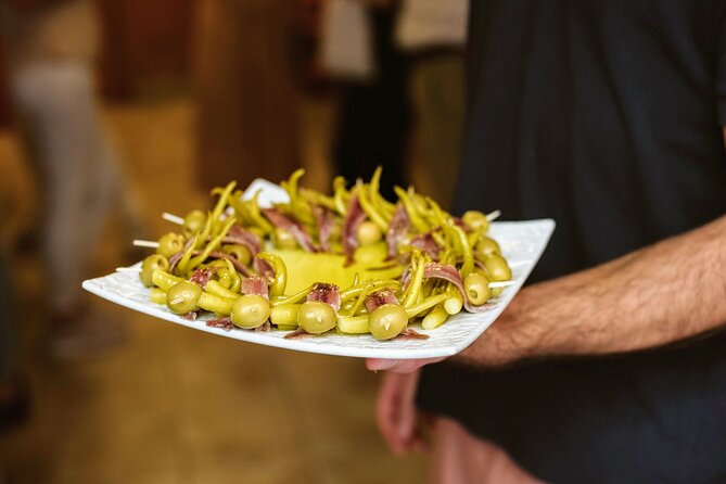 Madrid Tapas & Paella Cooking Experience with Local Market Visit - Sitting down to a generous Madrid lunch