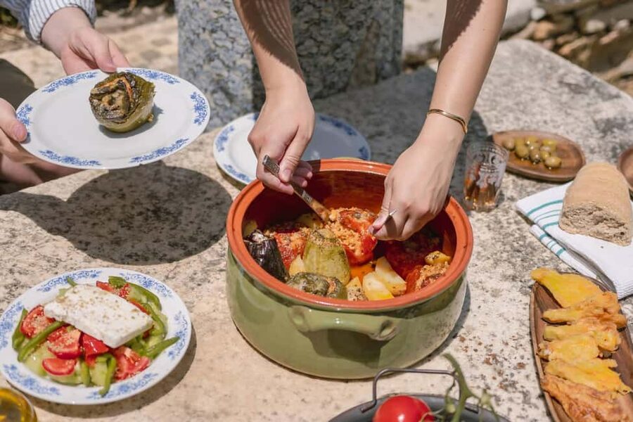 Naxos: Family Farm-table Cooking, Kouros Tour & Live Music - Cooking over a wood stove and open fire