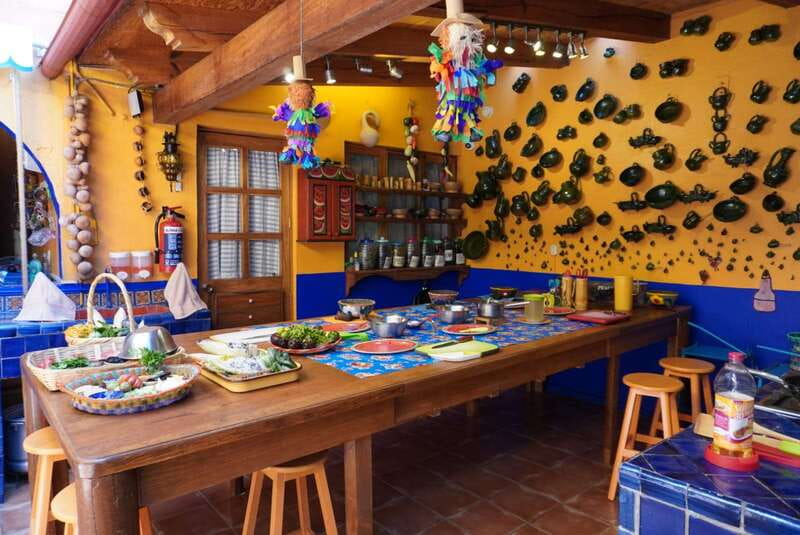 Oaxaca: Traditional Oaxacan Cooking Class with Market Visit - Handmade tortillas, clay pots, and wood-fire cooking