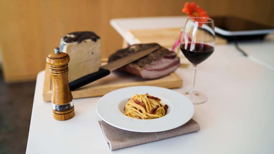 Olbia: cooking class on real pasta carbonara - Preparing carbonara with guanciale and mantecatura