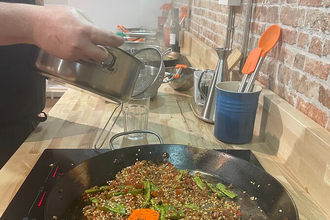 Paella and Burnt Basque Cheesecake Cooking Class (in Bilbao) - Sitting down for the meal you helped create