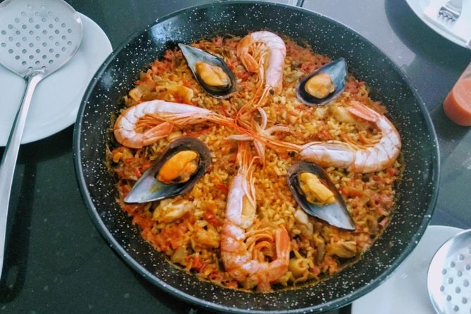 Paella Cooking Class in Malaga - Building paella from sofrito to final pan