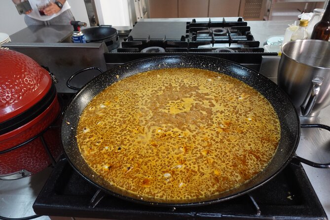 Paella & Sangria Class with Tapas and Market Visit - Mixing sangria and sharing tapas