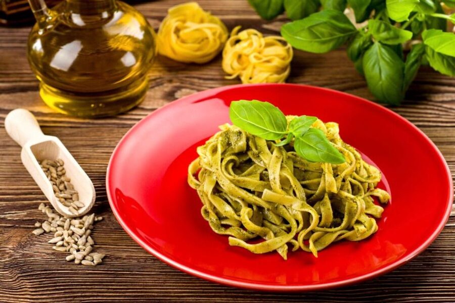 Pasta Cooking Class with Pesto Sauce Making in Rome Center - Crushing and mixing traditional Genovese pesto