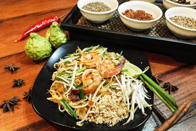 Pink Chili - Thai Cooking Class and Market Tour in Bangkok - Hands-on wok cooking and a shared meal