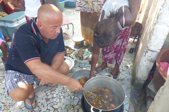Private Full-Day Gambian Home Cooking Experience in Banjul - Traditional dress and a welcome inside the compound