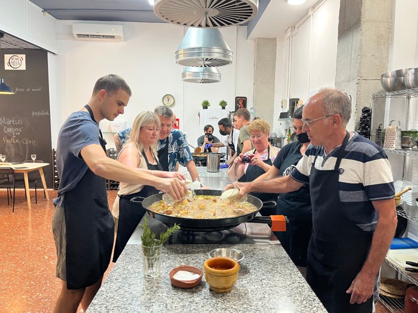 Real Paella Cooking Class – Market Visit & Sangría Workshop - Sitting down to eat what you made