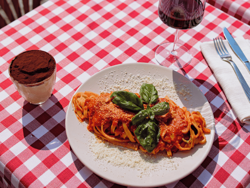 Rome: Pasta and Tiramisu Cooking Class in Piazza Navona - Rolling dough into fresh fettuccine