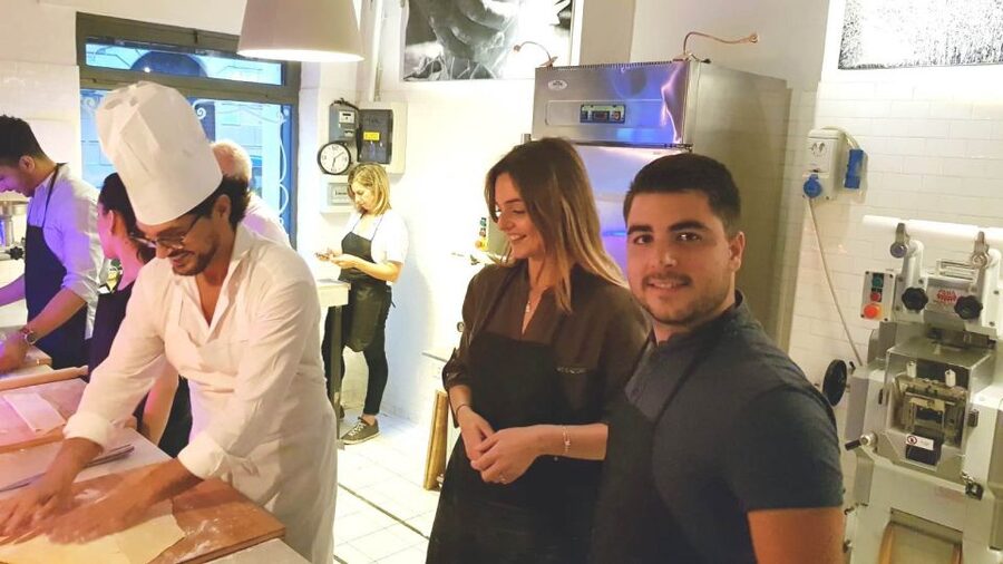 Rome: Pasta Cooking Class in a Professional Pasta Laboratory - Rolling the dough by hand instead of using a machine
