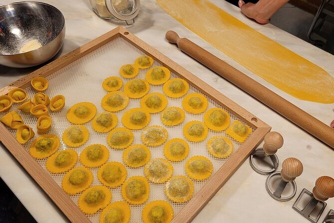 Rome Pasta Making Class with Italian Sauces and Wine Included - Sitting down to eat what you made