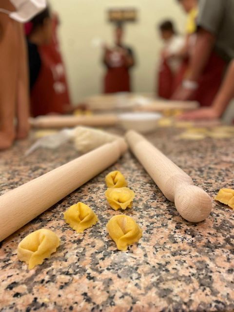 Rome: Pasta Making Class with Wine, Limoncello, and Dessert - Ravioli, tortelli, and fettuccine at one worktable
