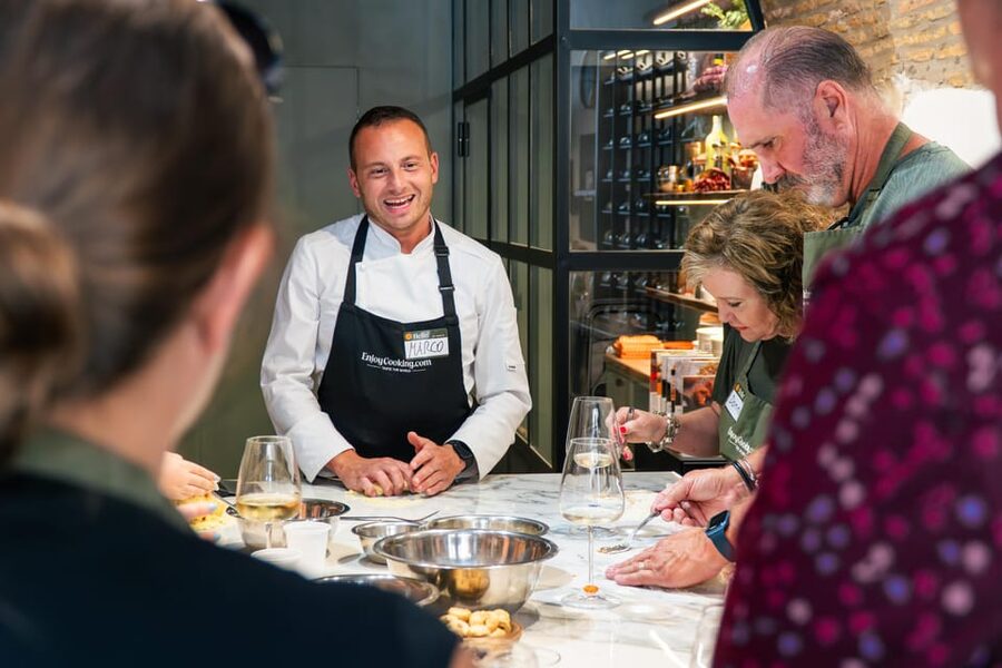 Rome: Pasta, Ravioli & Tiramisu Cooking Class by Colosseum - Making tiramisu from the creamy layers up