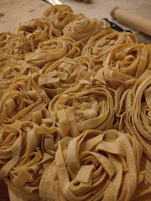 Rome: Pasta & Tiramisu Cooking Class near the Spanish Steps - A shared table, wine, and limoncello