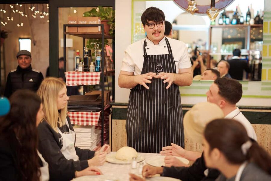 Rome: Pizza and Tiramisu Cooking Class in Piazza Navona - Rolling, topping, and baking your pizza