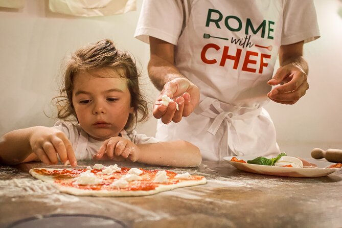 Rome: Pizza and Tiramisu Cooking Class Near the Colosseum - Sitting down to eat what you made
