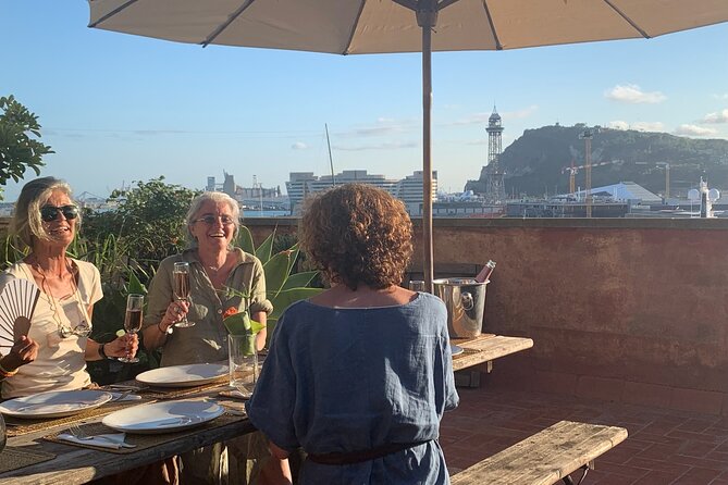 Rooftop Paella Seafood Cooking Class Experience in Barcelona - Dinner on the plant-filled rooftop terrace