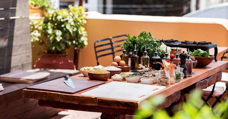 Santorini Cooking Class with Wine Tasting & Lunch - Cooking traditional dishes with a local chef