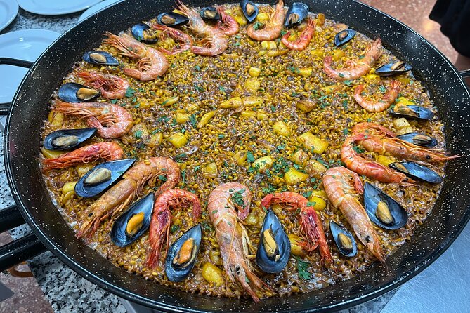 Seafood paella cooking class, tapas and visit to Ruzafa market. - Price, value, and practical drawbacks