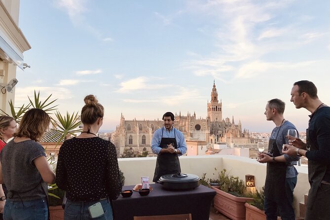 Sevilla: Rooftop Paella Cooking Class & 30-minute expert Q&A - Meeting beneath Seville’s Roman columns