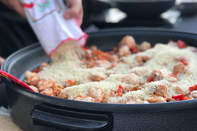 Sevilla: Rooftop Paella Cooking Class & 30-minute expert Q&A - Welcome drink, appetizers, and the first taste of the evening